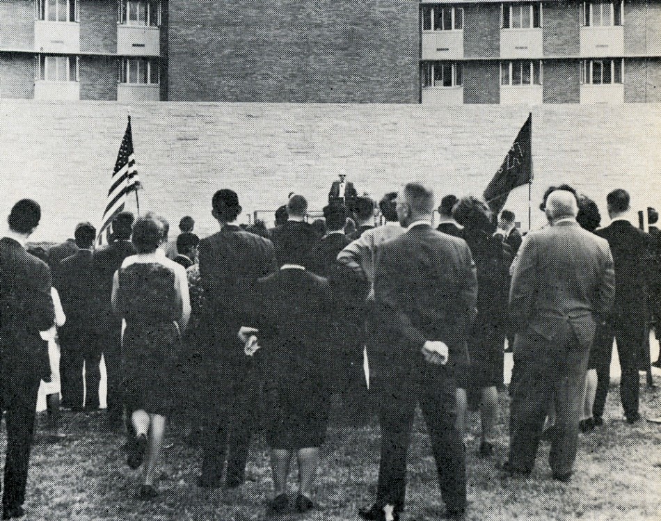 Members of a standing-room-only crowd listen to Dr. McCollum as he speaks from the platform set up in front of McCollum Hall. Published in Kansas Alumni magazine, Dec. 1965-Jan. 1966.