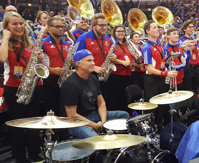 Chad Smith of Red Hot Chili Peppers jamming with the Jayhawk mens's basketball band