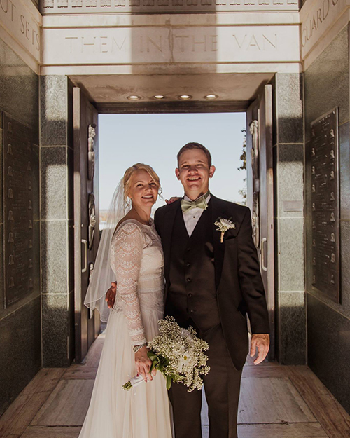 Abby Corrin and her husband take wedding photos in the Campanile