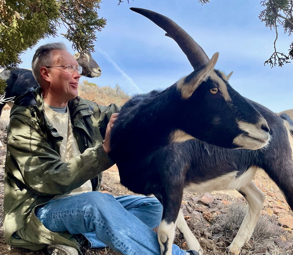Brian Robison pets a goat