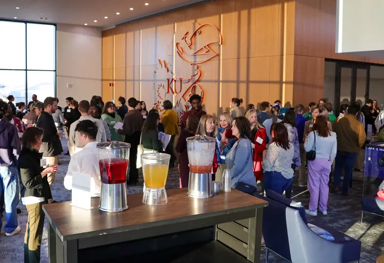 Students and alumni network at Mocktails & Mingle at the Jayhawk Welcome Center