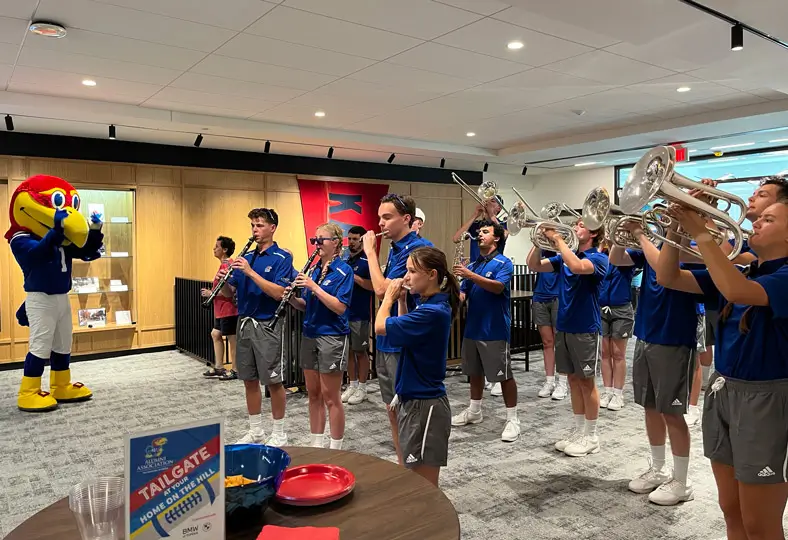 Marching Jayhawks performing at the Adams Alumni Center